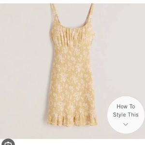 Yellow smocked mini dress